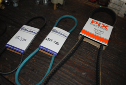 Shown are an automotive timing belt for a boat, a conveyor belt and a v-belt at our store.